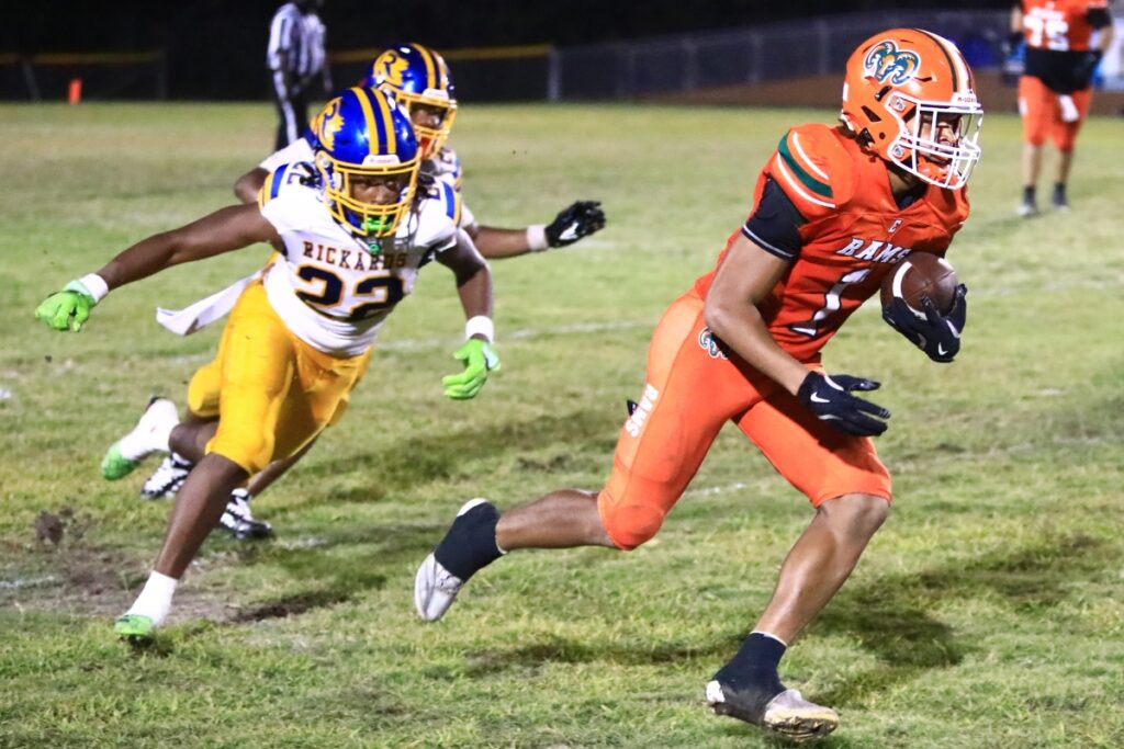 Eastside's Marcus Coefield (1) with a catch against Rickards (Tallahassee). Photo by C.J. Gish