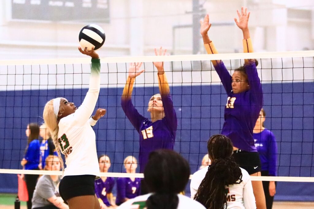 Eastside's Ra'Miya Bradley with a hit against Union County's Lydia Waugh (19) and Jailyn Simmons (13) on Thursday. Photo by C.J. Gish