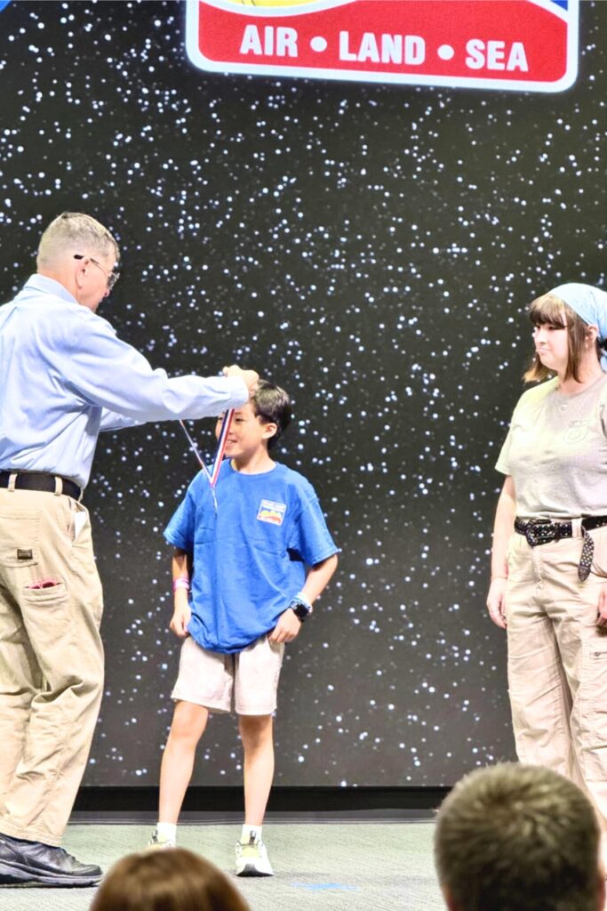 Nathan Tran receives his medal at Space Camp Robotics. Courtesy of Oak Hall School