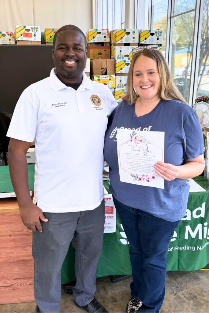 Pastor Adam Joy partners with Bread of the Mighty to serve the community with Deeper Purpose's food bank. Courtesy of DPCC