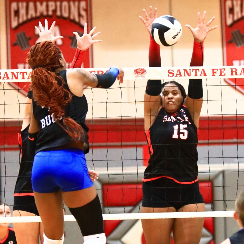 Santa Fe's Ajah Graddy (15) attempts to block a hit by Branford's Adriauna Combs (4). Photo by C.J. Gish