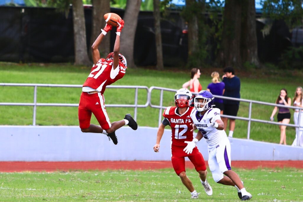 Santa Fe's Elon James with a first-quarter interception against Gainesville on Thursday. Photo by C.J. Gish