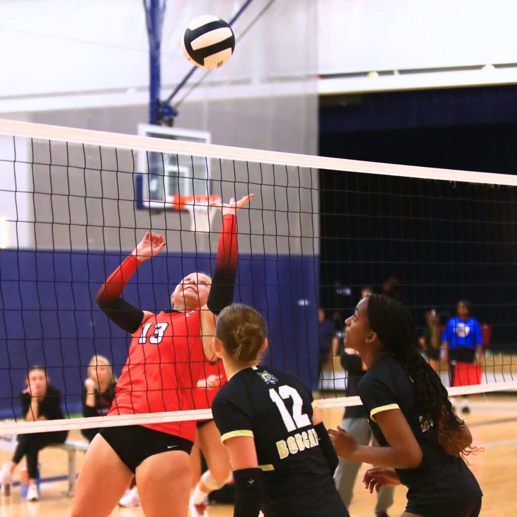 Santa Fe's Gracyn Marshall tips the ball against Buchholz on Thursday. Photo by C.J. Gish