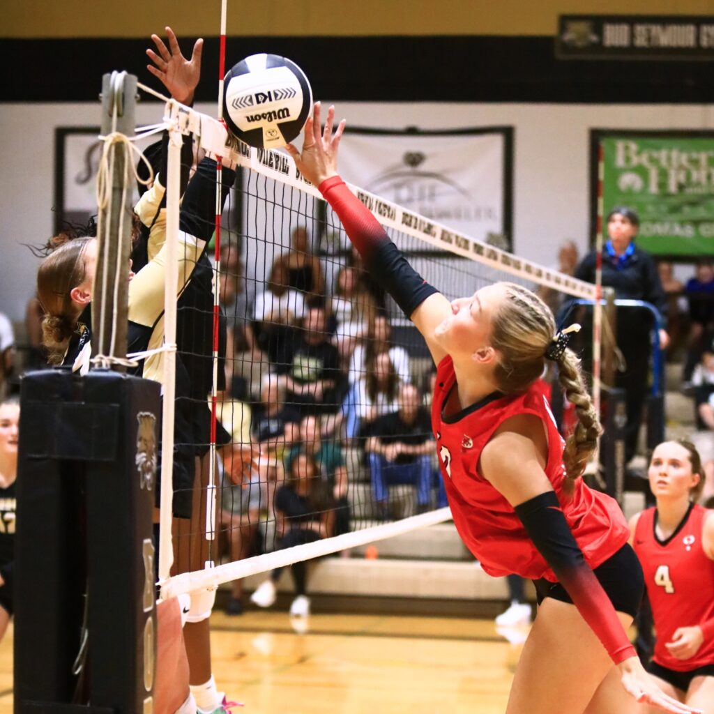 Santa Fe's June Poser-Wipke (3) with a hit against Buchholz. Photo by C.J. Gish