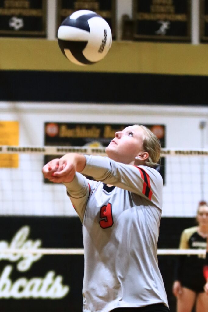 Santa Fe's Karlee Noah (9) with a dig against Buchholz. Photo by C.J. Gish