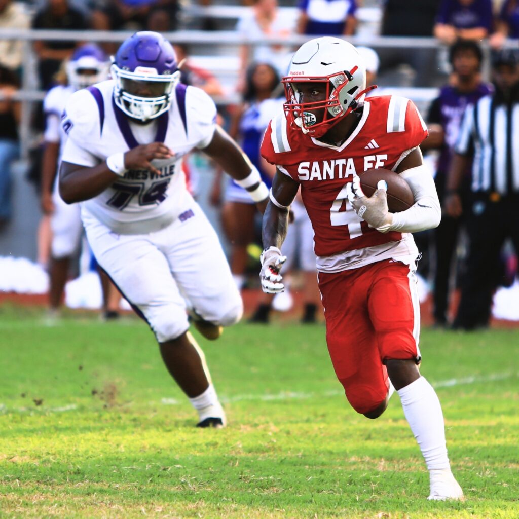 Santa Fe's Keimarion Neal with a run against Gainesville on Thursday. Photo by C.J. Gish