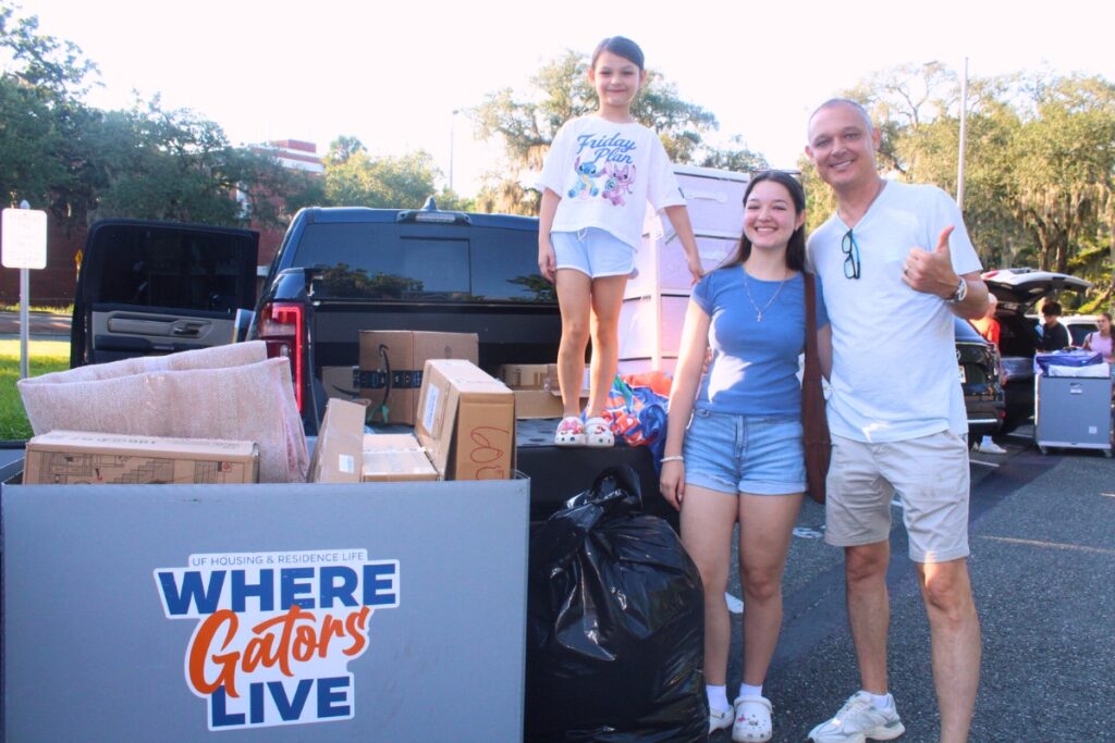The Skoroz family poses for a photo during UF fall move-in on Saturday morning. Photo by Nick Anshultz