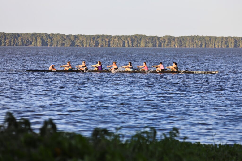 Rowers practice in Newnans Lake.
