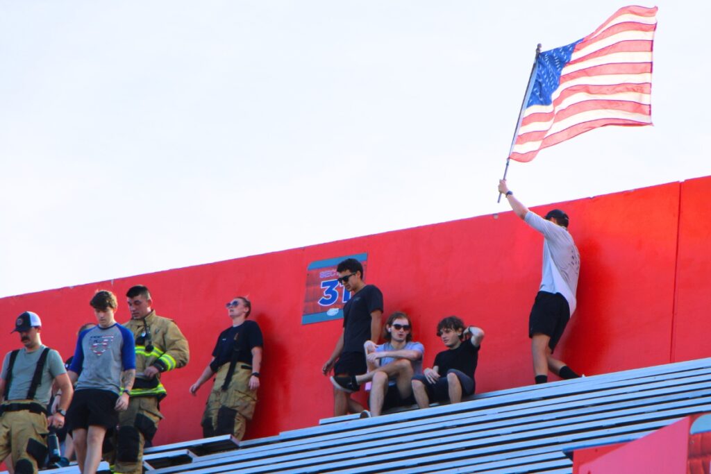 A Gainesville Fire Rescue firefighters pushes to the top of Ben Hill Griffin Stadium during the 911 remembrance stair climb. Photo by Lillian Hamman