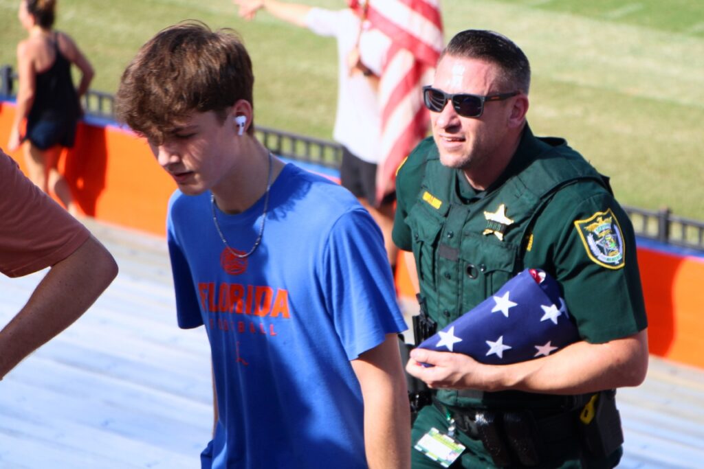 Alachua County Sheriff's Office's Chris Sims climbs at Ben Hill Griffin Stadium at the 911 remembrance stair climb. Photo by Lillian Hamman