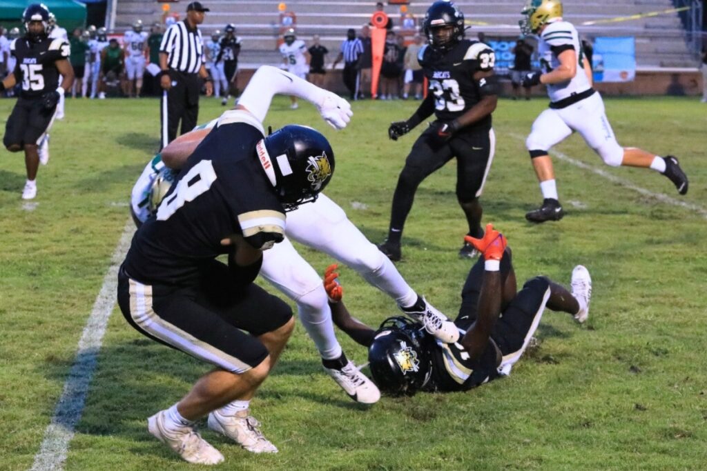 Buchholz defenders tackle a Nease (Ponte Vedra) runner. Photo by Seth Johnson