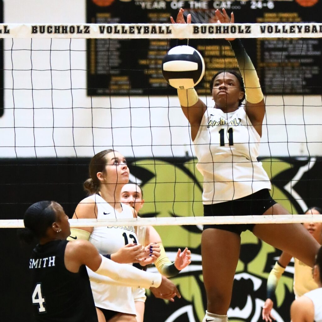 Buchholz's Demmi Strappy (11) with a block against West Port (Ocala). Photo by C.J. Gish