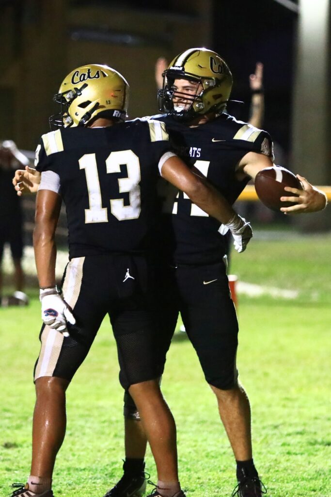 Buchholz's Emari Colter (14) celebrates with Justin Williams (13) after catching a fourth-quarter touchdown pass against Eastside. Photo by C.J. Gish