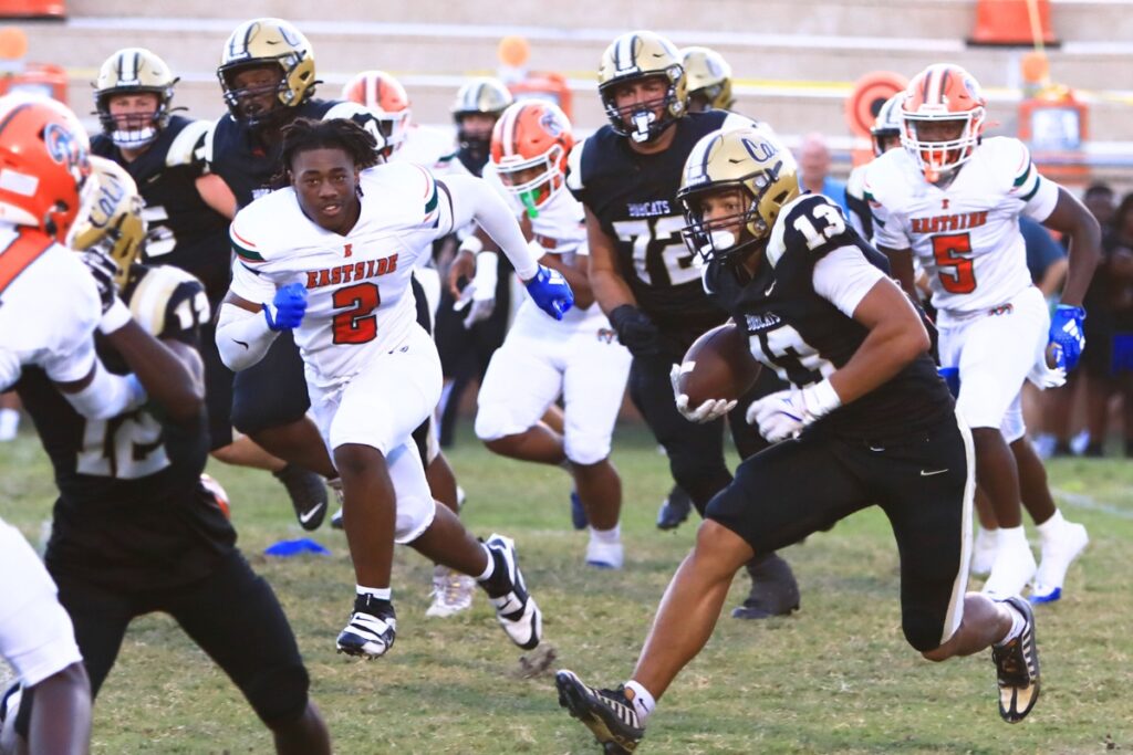 Buchholz's Justin Williams (13) with a first-quarter run against Eastside. Photo by C.J. Gish