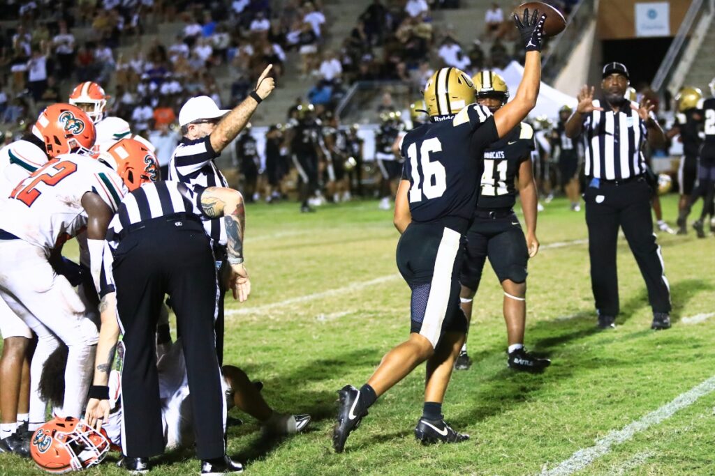 Buchholz's Ray Sanchez (16) comes away with a third-quarter Eastside fumble. Photo by C.J. Gish