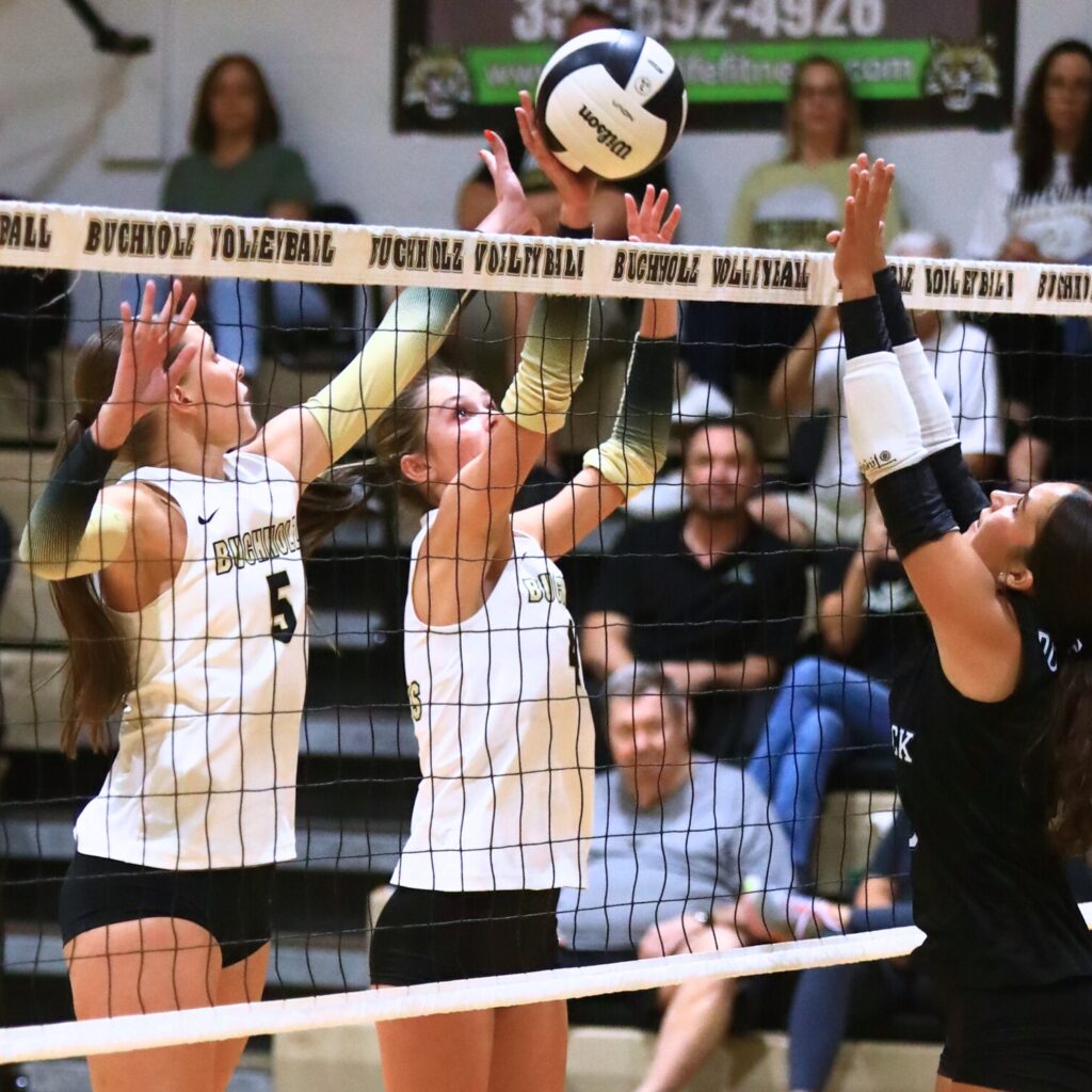Buchholz's Victoria Trucco (5) and Maddie Thomas (4) go for a block against West Port (Ocala). Photo by C.J. Gish