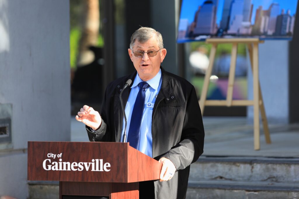 Commissioner Ed Book speaks at the city's ceremony. Photo by Seth Johnson