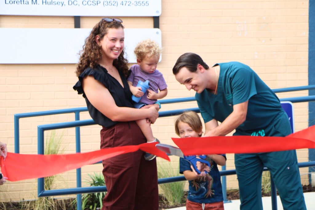 David Pabst (far right) and family cut the ribbon to celebrate opening of Pabst Personal Care in Newberry. Photo by Lillian Hamman