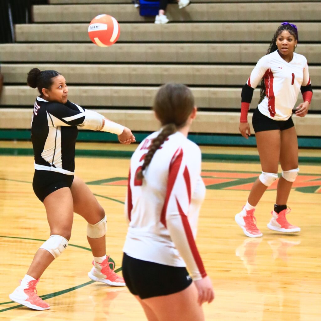 Dixie County's Jaicee Brown (6) with a dig against Eastside. Photo by C.J. Gish