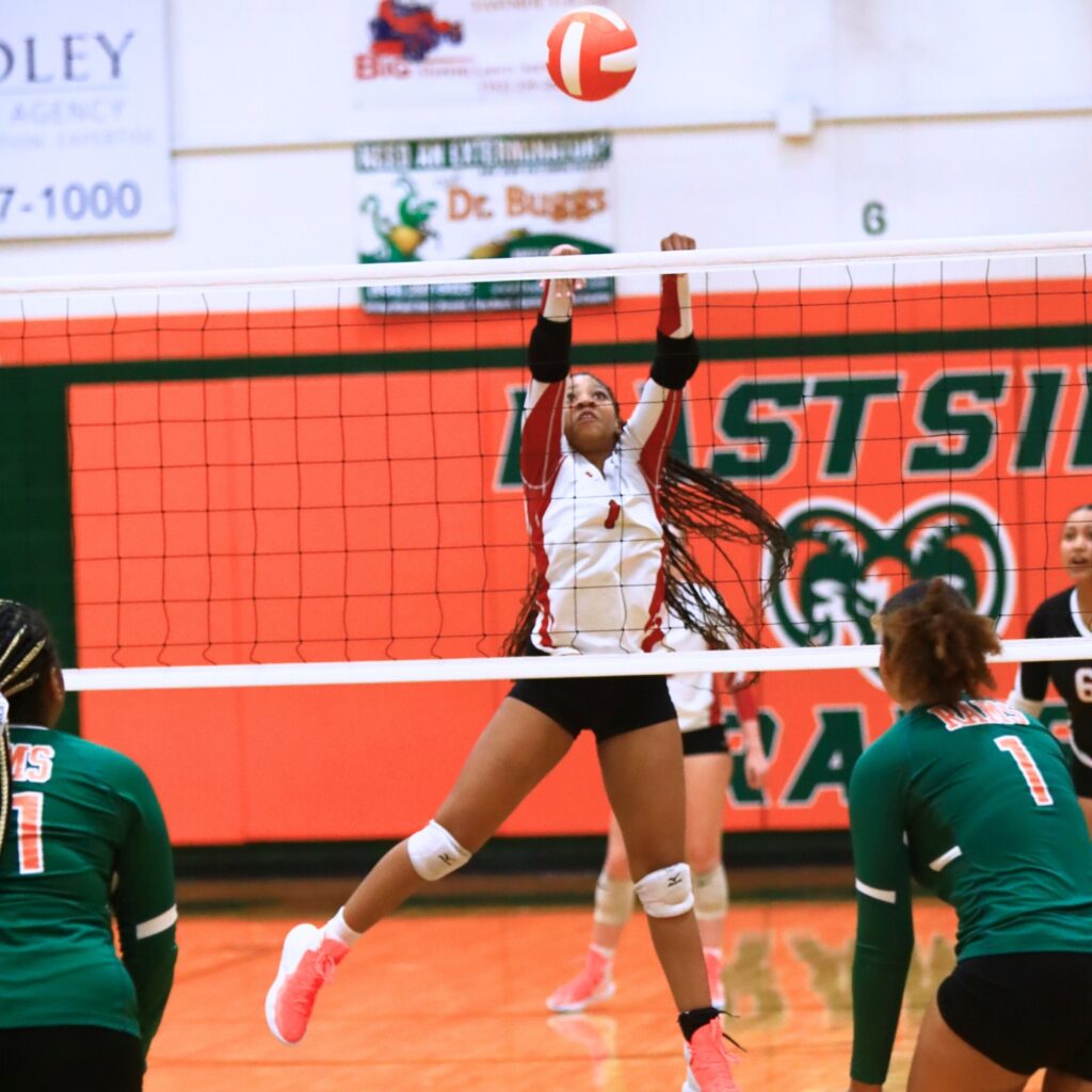 Dixie County's Kamille Barnes (1) with a tip against Eastside. Photo by C.J. Gish