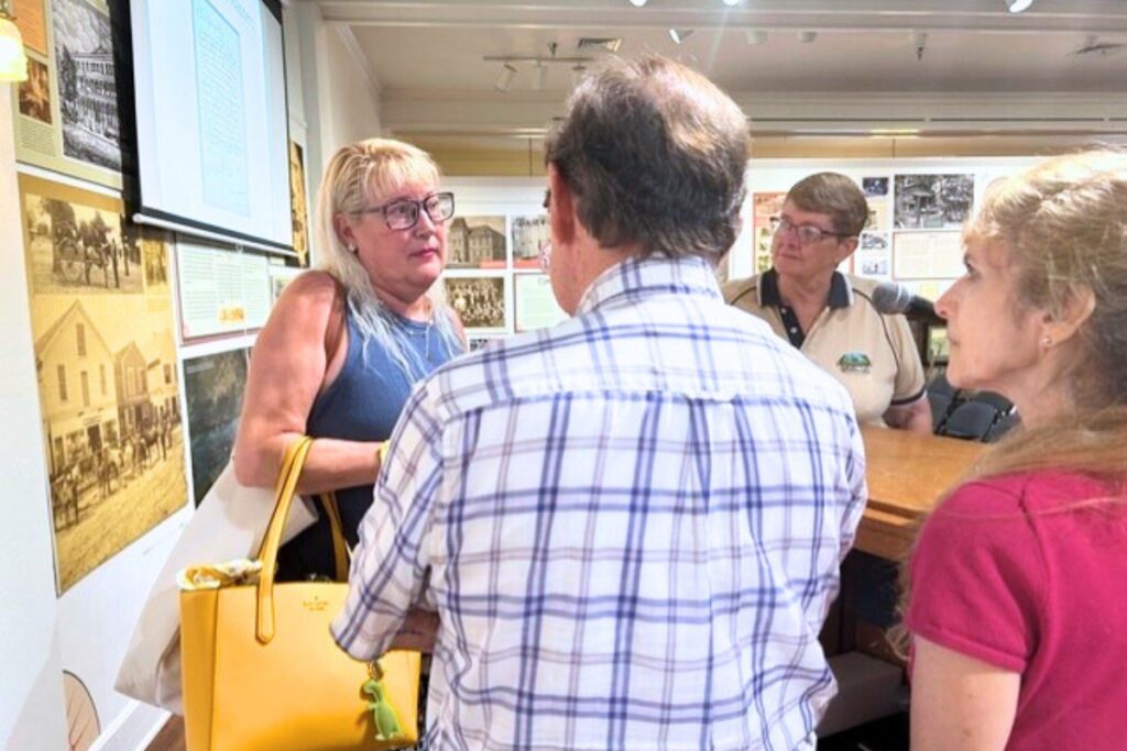 Dr, Kimblerly Voss (left) meets with some members of the audience who attended her talk at the Matheson History Museum. Photo by Ronnie Lovler