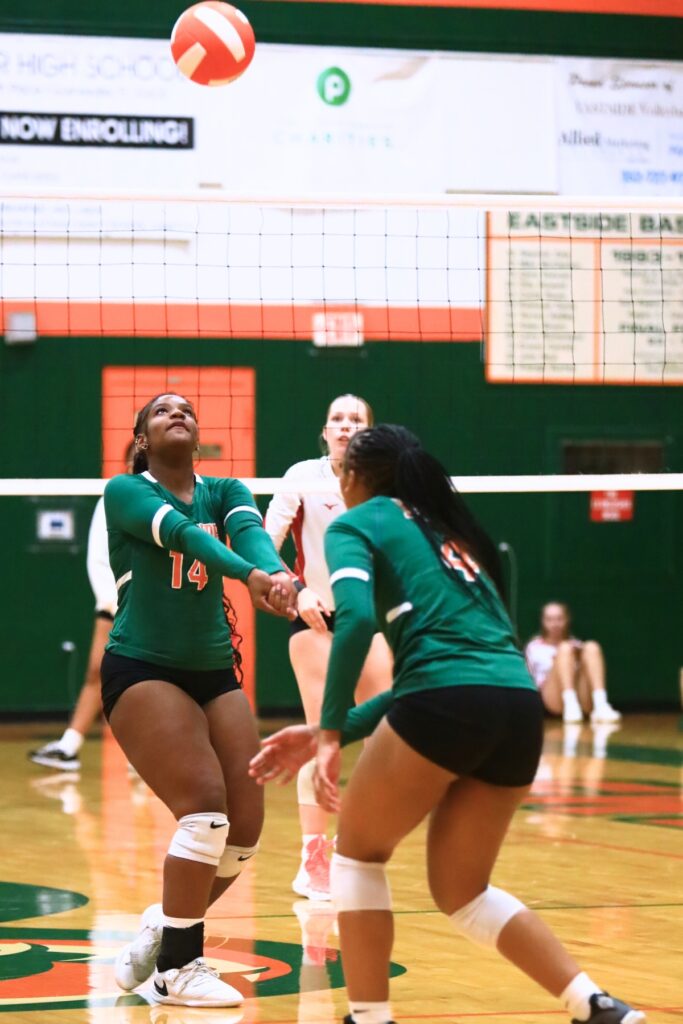 Eastside's Ivy McFarland (14) with a dig against Dixie County. Photo by C.J. Gish