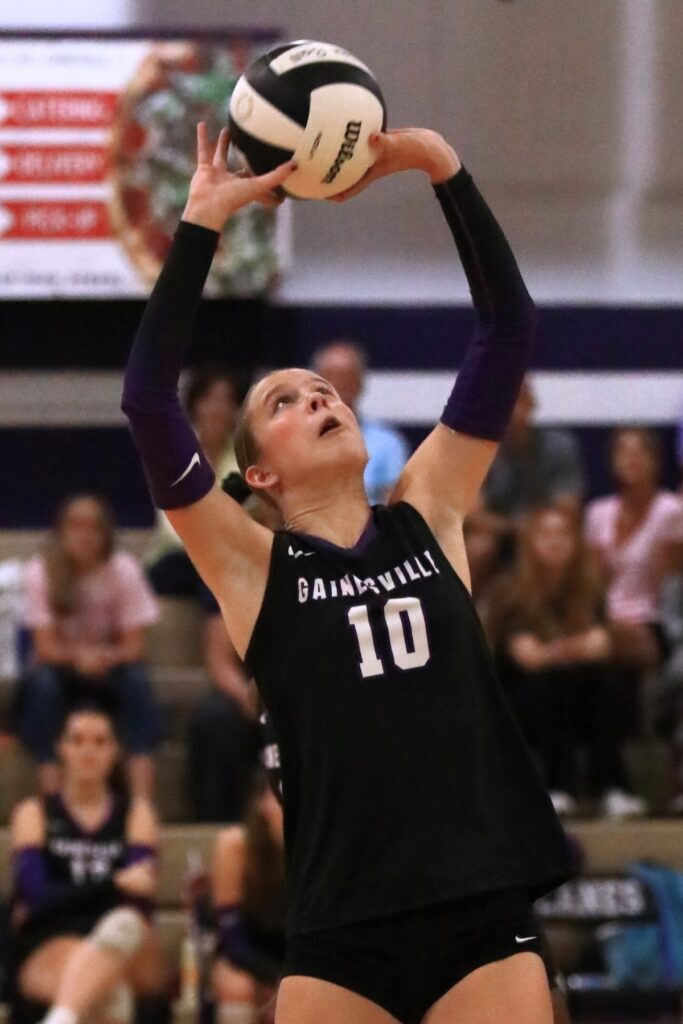 Gainesville's Charlotte Judge (10) with a set against Forest (Ocala). Photo by C.J. Gish