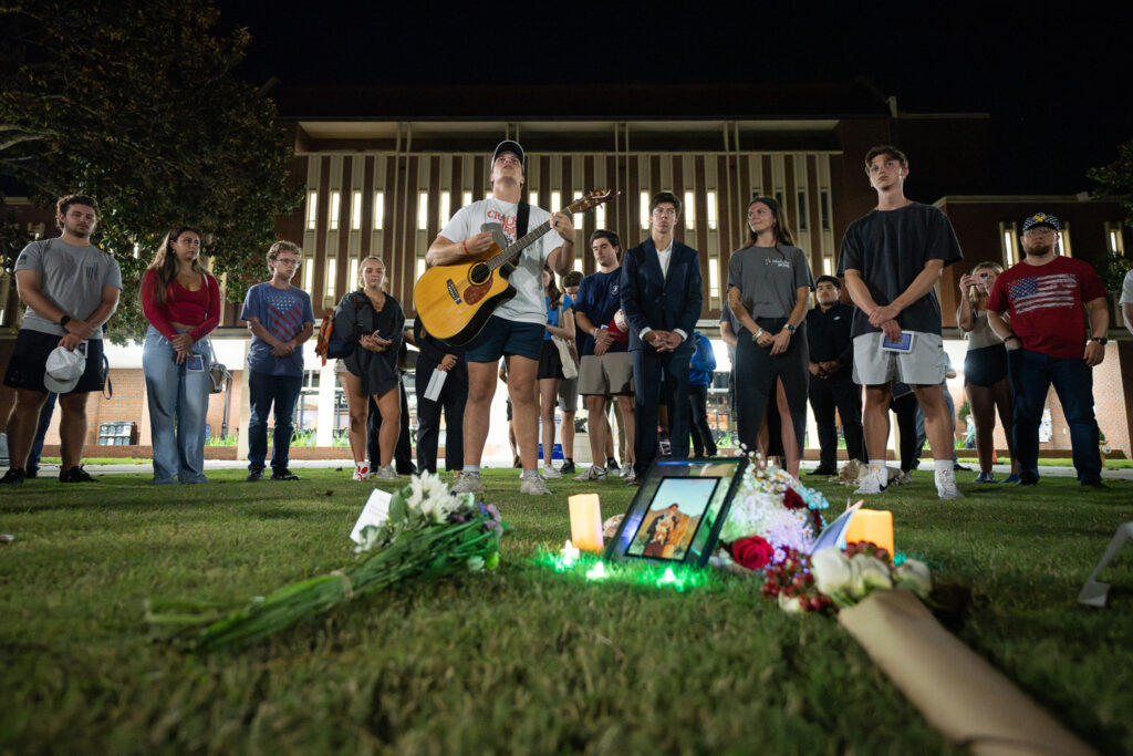 Matt O'Hara plays guitar and leads the prayer vigil in several Christian songs.