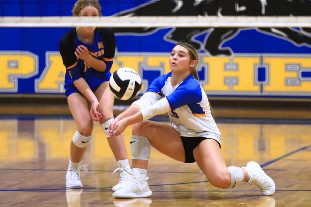 Newberry's Riley Keith with a dig against Union County. Photo by C.J. Gish