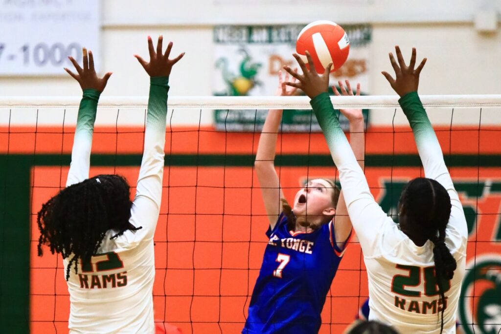 P.K. Yonge's Jaylee Fugate (7) battles at the net with Eastside's Anijah Goss (12) and Taylor Flowers (28). Photo by C.J. Gish