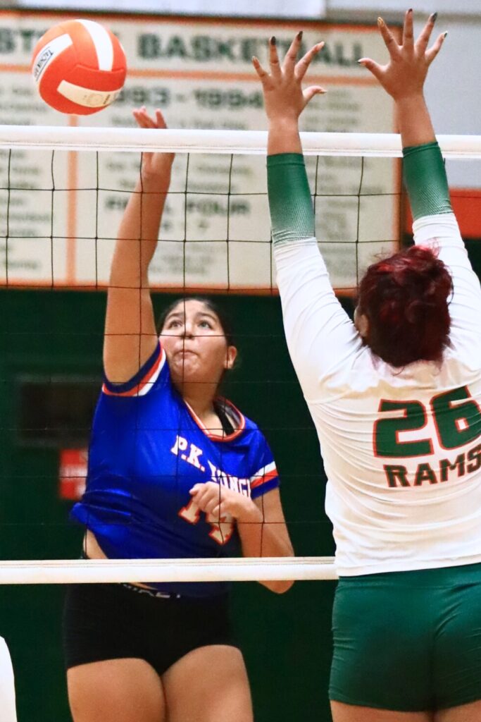 P.K. Yonge's Ruby Hampton (14) with a hit against Eastside's Laelia Torres (26). Photo by C.J. Gish