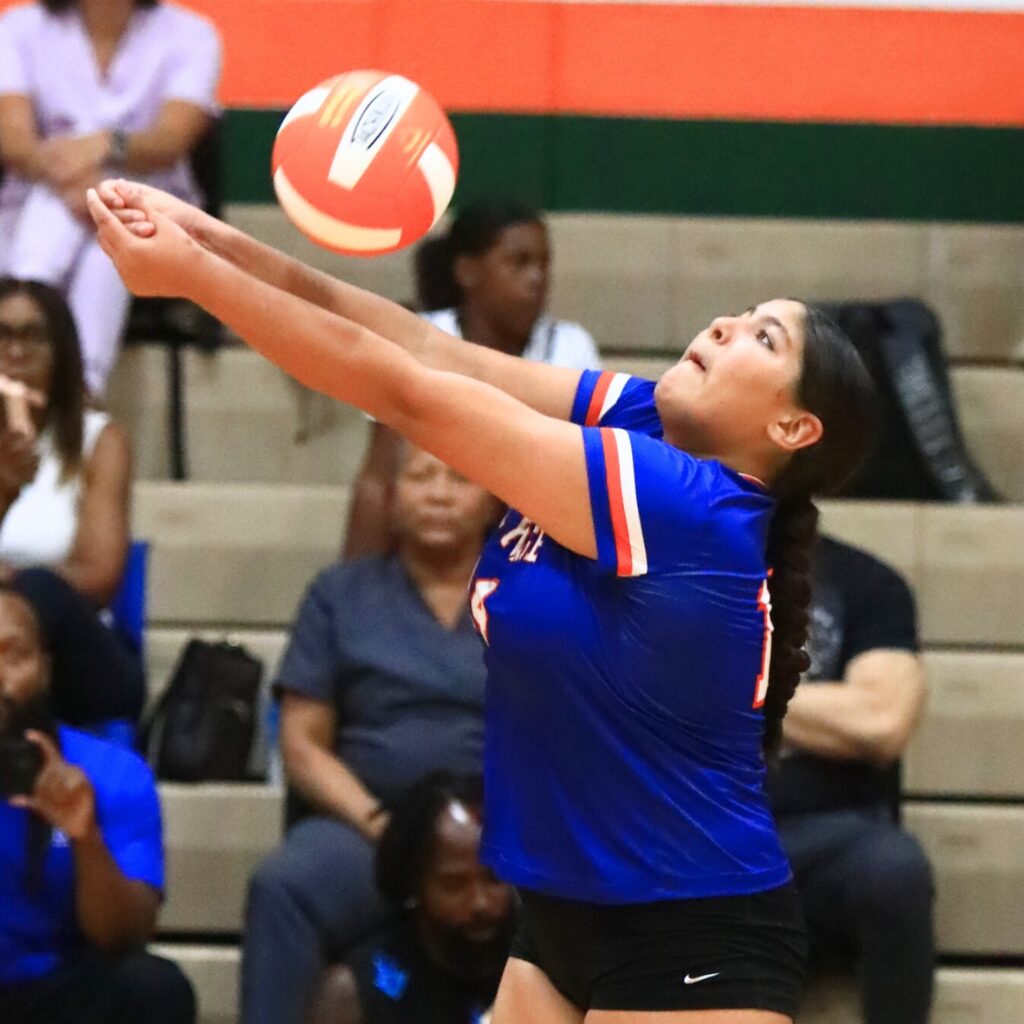P.K. Yonge's Ruby Hampton with a dig against Eastside. Photo by C.J. Gish