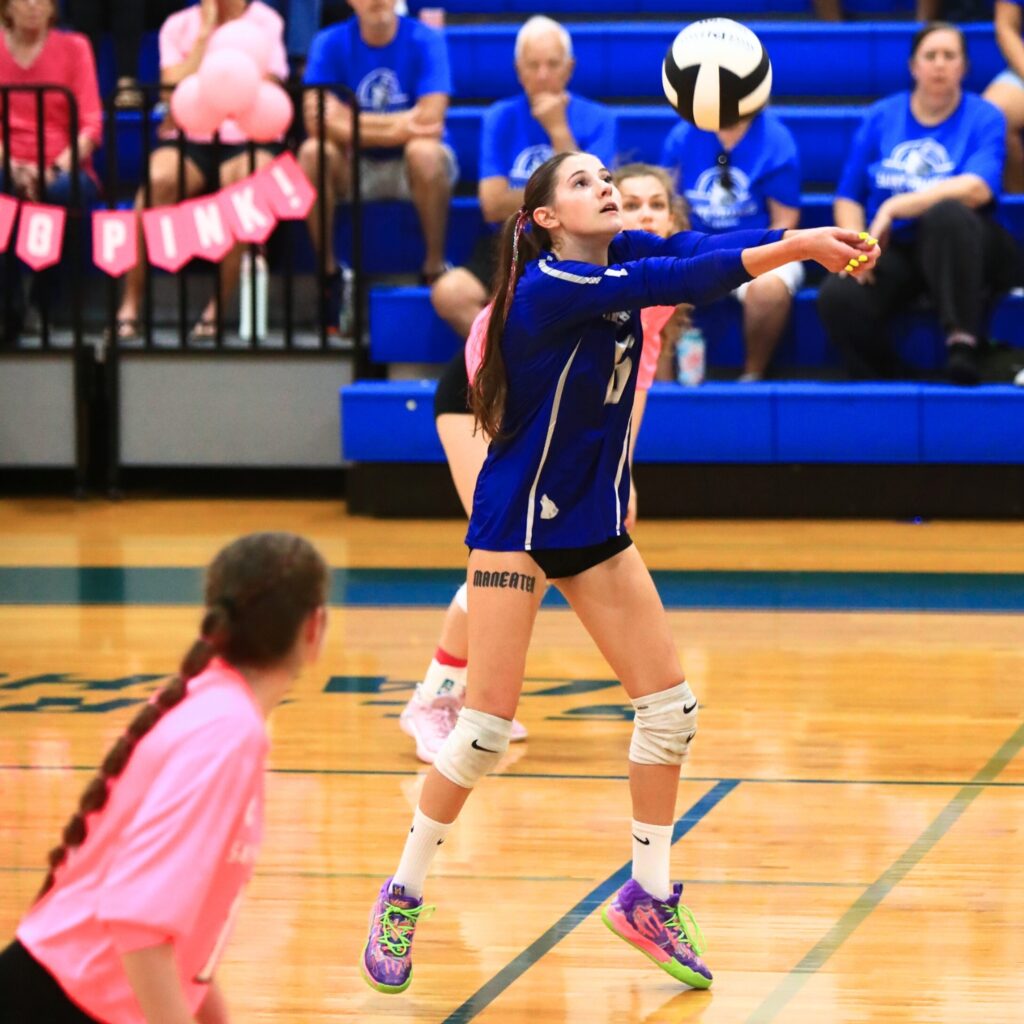 Saint Francis Catholic's Tabitha Billings (6) with a dig against The Rock. Photo by C.J. Gish
