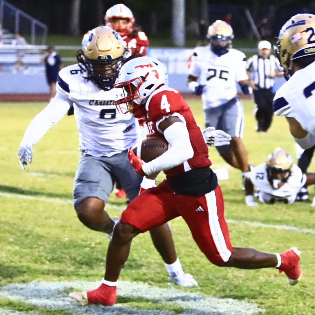 Santa Fe's Keimarion Neal (4) runs for a first down against University Christian (Jacksonville). Photo by C.J. Gish