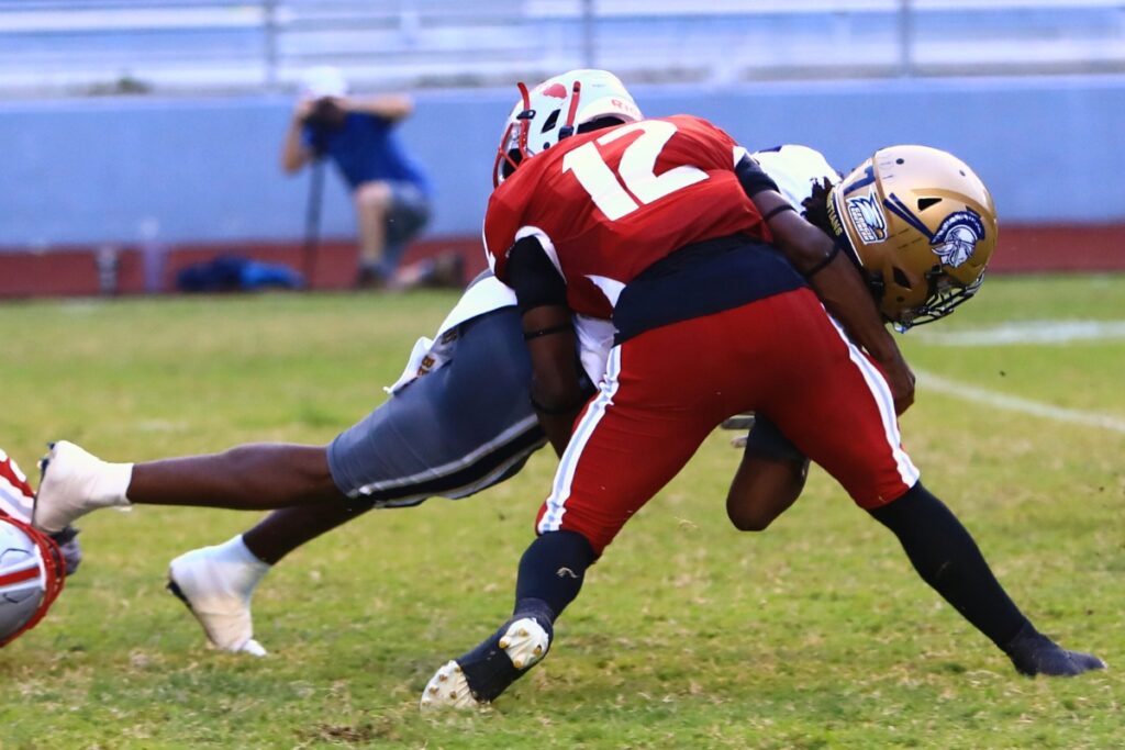 Santa Fe's Malcolm Merriex (12) with a tackle against University Christian (Jacksonville). Photo by C.J. Gish 1