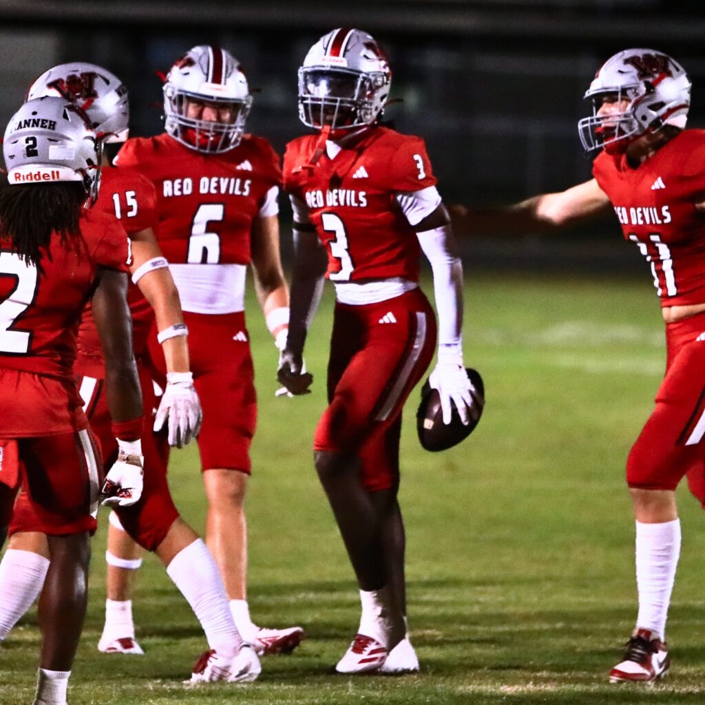 Williston's Kyrin Penny (3) celebrates after a second-quarter interception against Lake Minneola. Photo by C.J. Gish