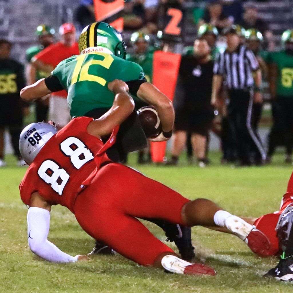 Williston's Ramey Webb (88) with a sack against Lake Minneola. Photo by C.J. Gish