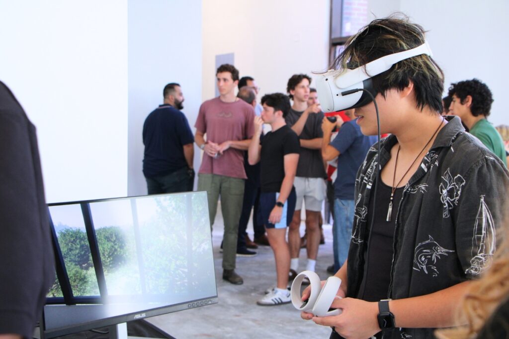 A student tours the Ramos Collaboratory using virtual reality technology. Photo by Lillian Hamman