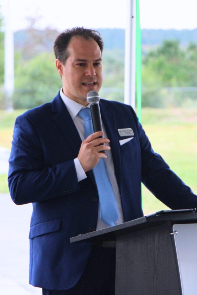 Alachua Interim City Manager Rodolfo Valladares helps unveil the new water management facility and 1-million-gallon capacity wellfield. Photo by Lillian Hamman
