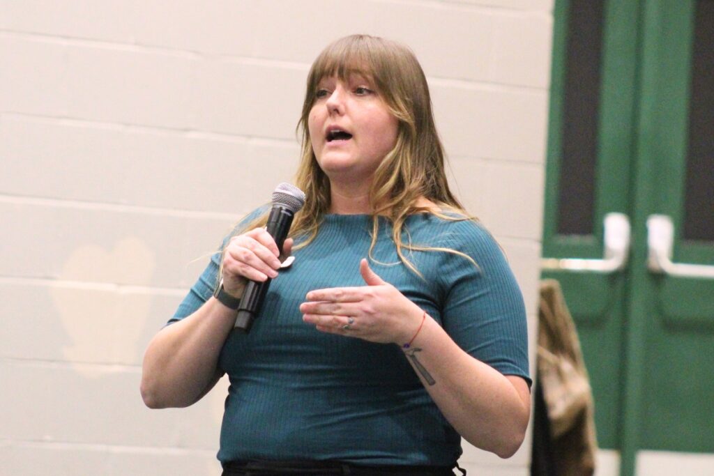 Allysen Marks, executive director of Kids Count in Alachua County, speaks at Wednesday night's town hall meeting. Photo by Nick Anschultz