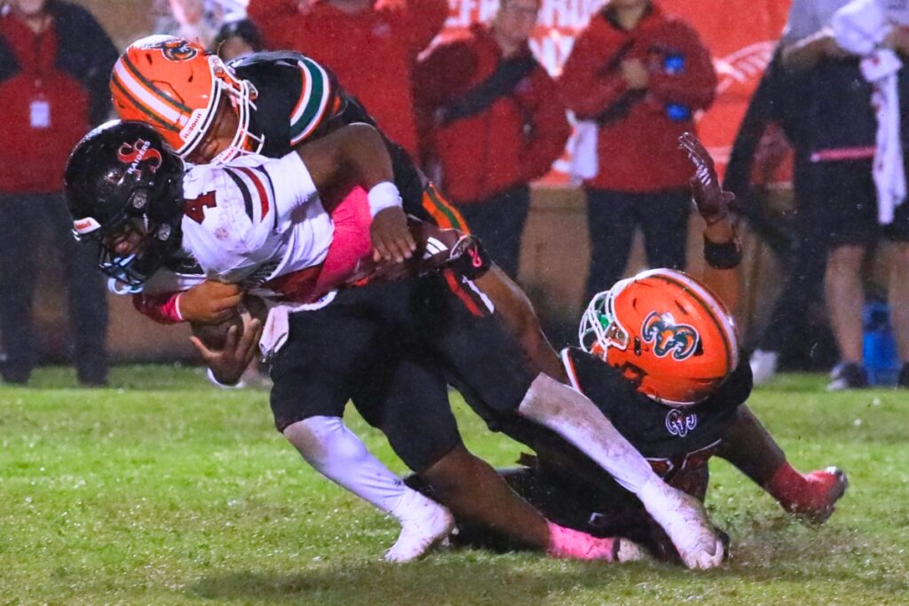 An Eastside defender brings down a South Sumter runner. Photo by Seth Johnson