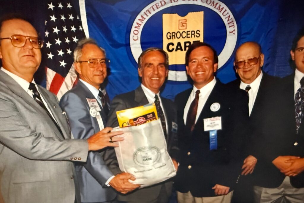 Bob Hitchcock (second from right) and Alan Hitchcock (third from right) attend the National Grocers Association meeting in Washington, D.C., where Bob was awarded the Spirit of America Award for his commitment to the community. Courtesy of Alan Hitchcock