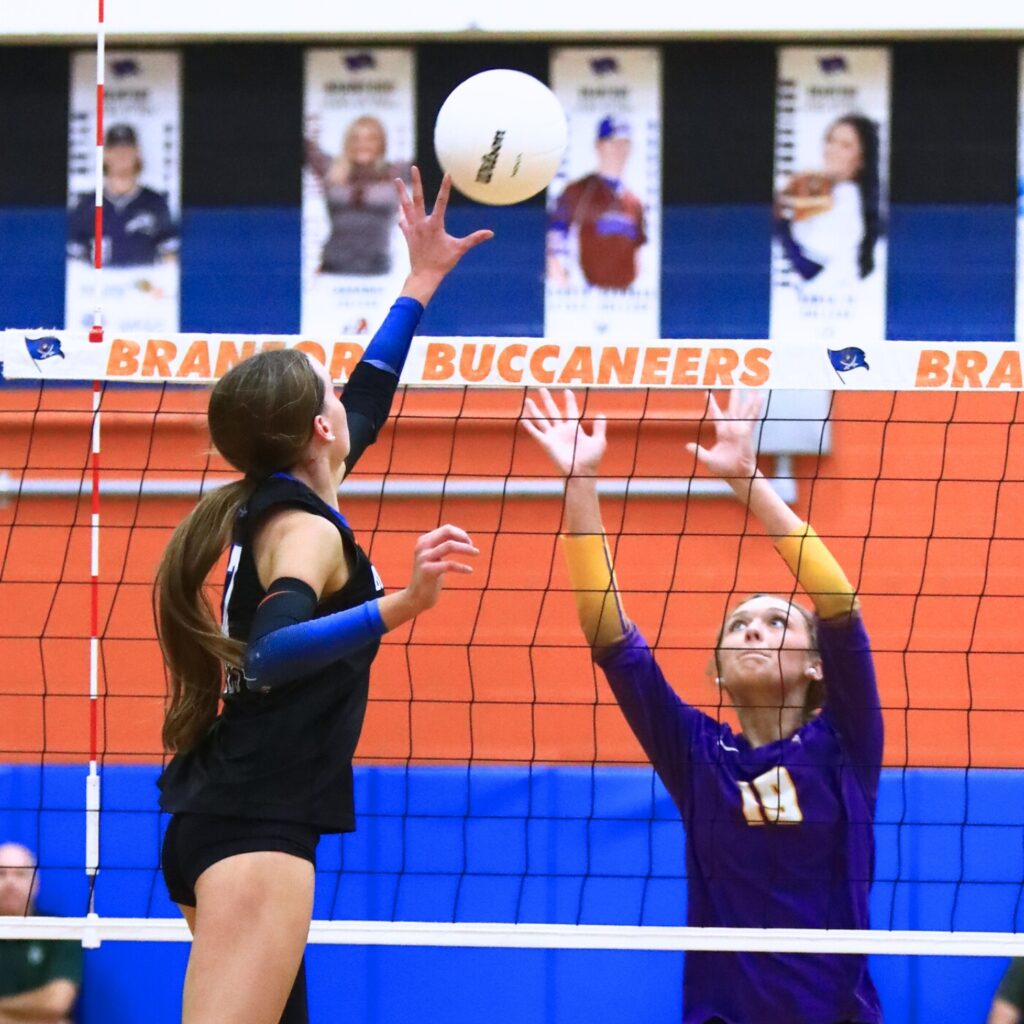 Branford's Lalyn Sikes (7) with a hit against Union County's Lydia Waugh (19). Photo by C.J. Gish