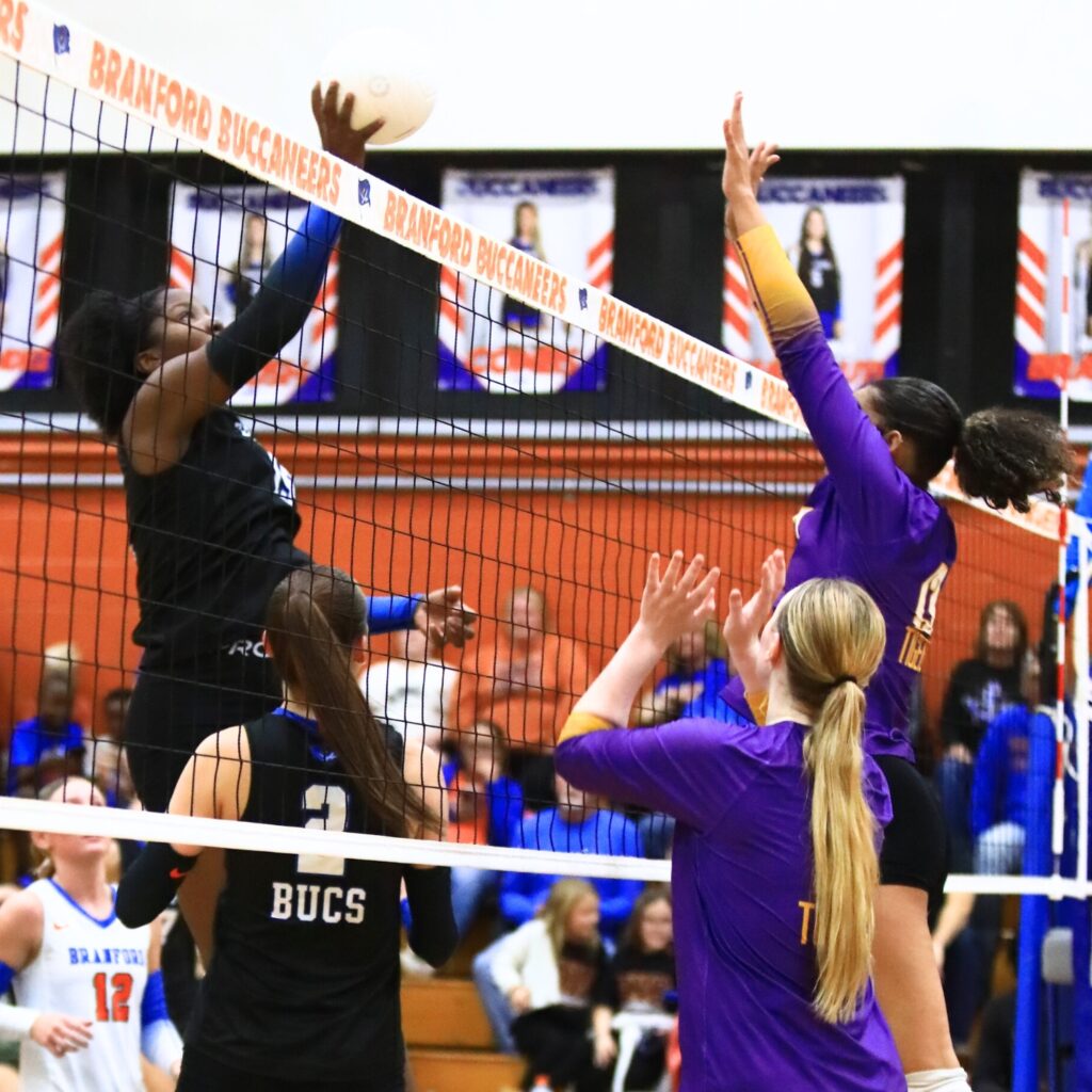 Branford's Mallory Blue (15) with a hit against Union County's Jailyn Simmons (13). Photo by C.J. Gish