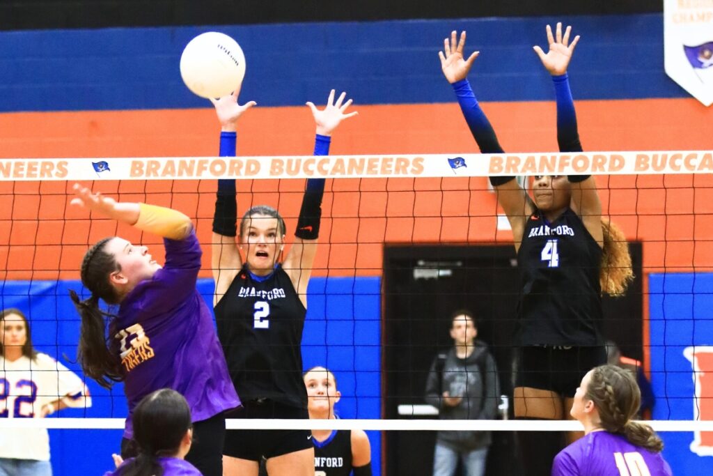 Branford's Mylie Fernandez (2) and Adriauna Combs (4) attempt to block Union County's Indi Knox (25). Photo by C.J. Gish