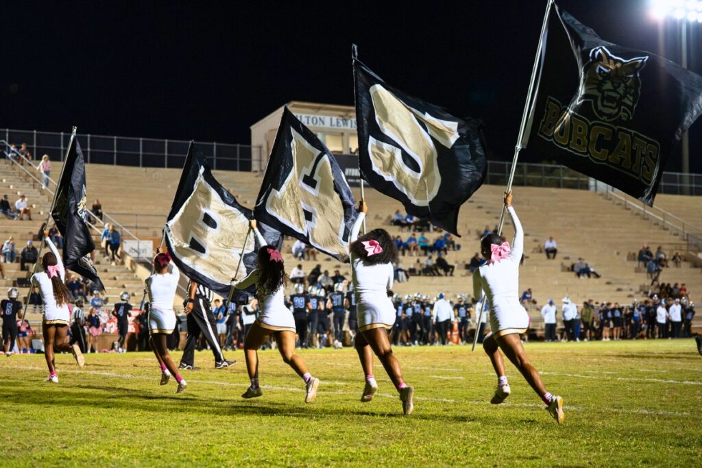 Buchholz cheerleaders run into the end zone following a touchdown against Bartram Trail (St. Johns). Photo by Tim Rodriquez