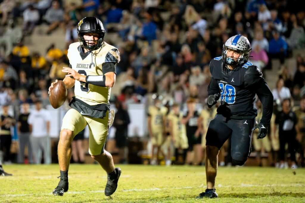 Buchholz quarterback Andrew Whittemore looks downfield to pass against Bartram Trail (St. Johns). Photo by Tim Rodriquez