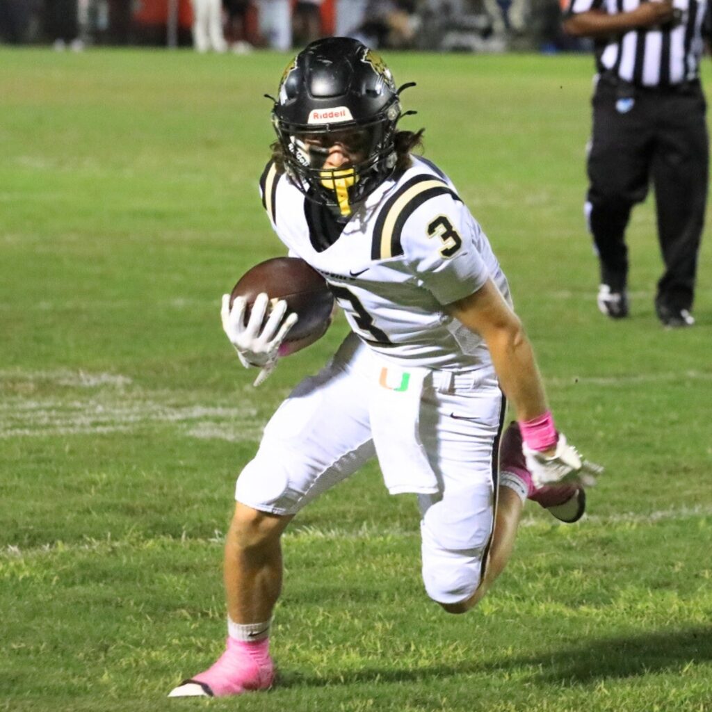 Buchholz's Avery Norris sprints for the end zone against Gainesville. Photo by Seth Johnson