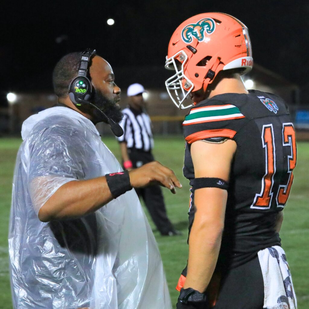 Eastside head coach Gator Hoskins calls a play with quarterback Nelson Tambling. Photo by Seth Johnson