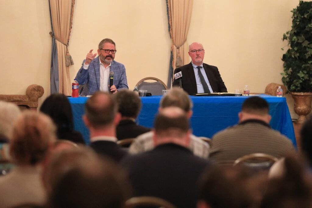 GRU General Manager Ed Bielarski (left) and Gainesville Mayor Harvey Ward (right) debate ahead of the utility referendum. Photo by Seth Johnson